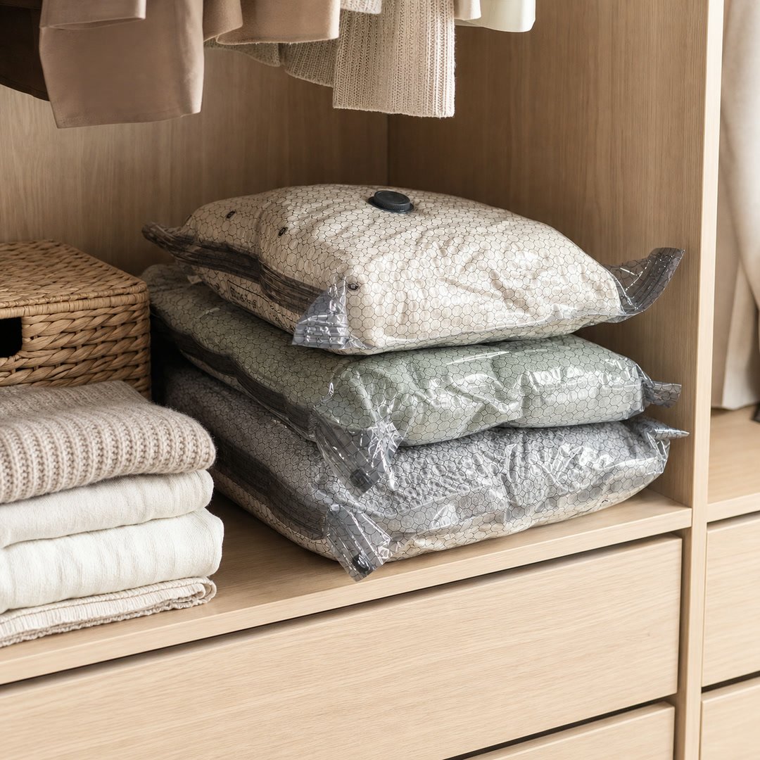 Compressed bedding organized neatly on a closet shelf