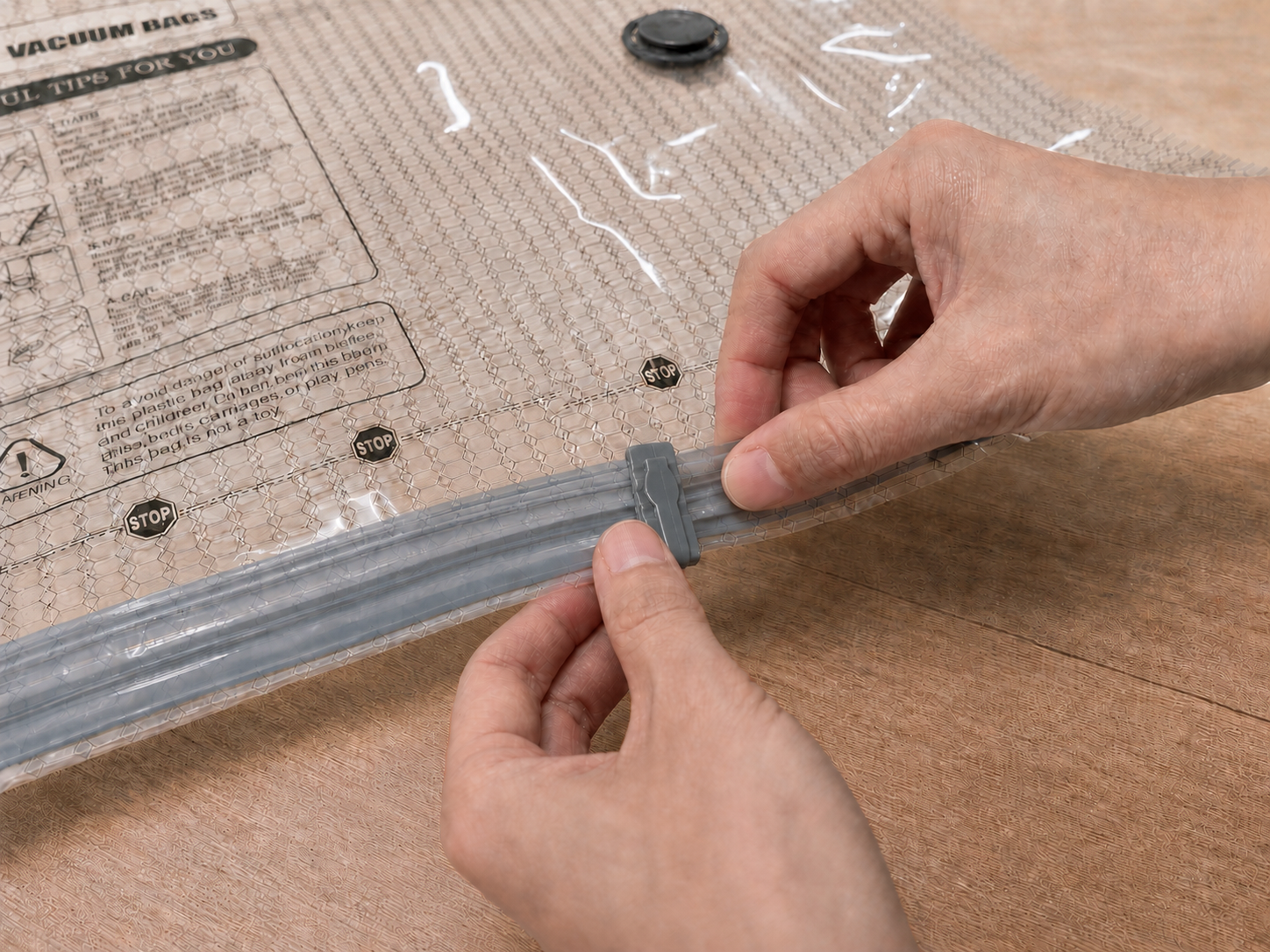 Close view of the slider and double zip seal on a filled compression bag